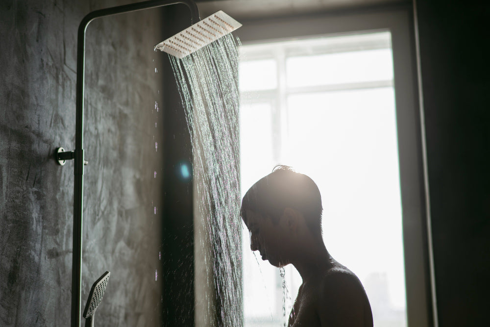 "Side-by-side display of a fixed shower head, handheld shower head, and dual system, highlighting the pros and cons of each design for different showering preferences."