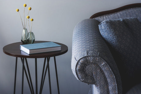 "Various side tables used in different settings—beside a sofa, bed, and in a hallway—showcasing their multifunctional design and adaptability in home decor."