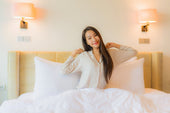  "Couple peacefully sleeping on a spacious king size mattress, highlighting benefits like extra space, motion isolation, and improved sleep posture."