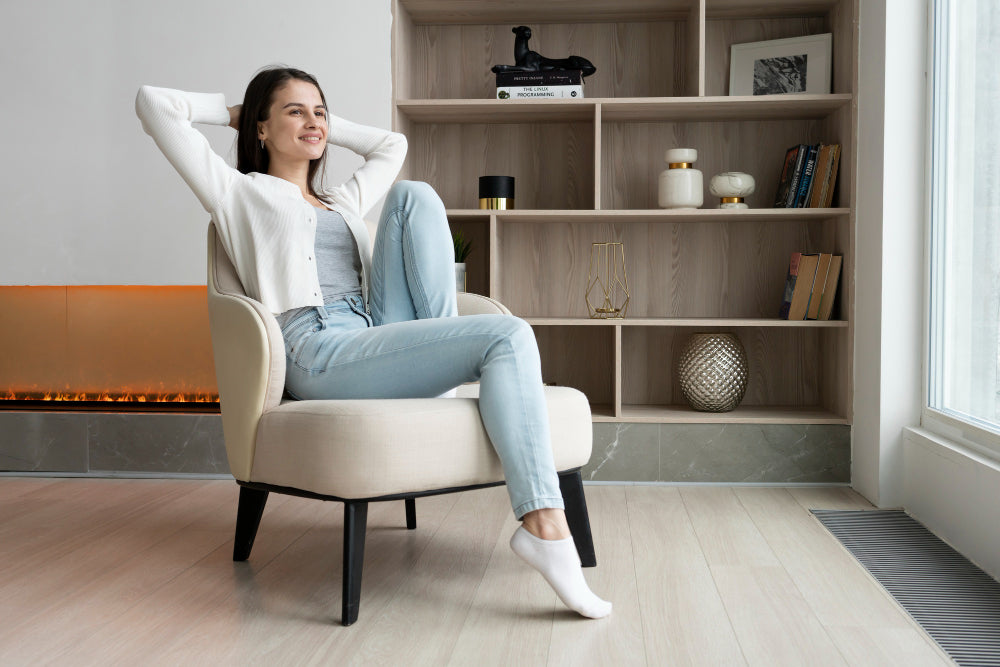 "Elegant armchairs arranged in a serene corner with soft lighting and cozy accents, designed for comfort and unwinding."