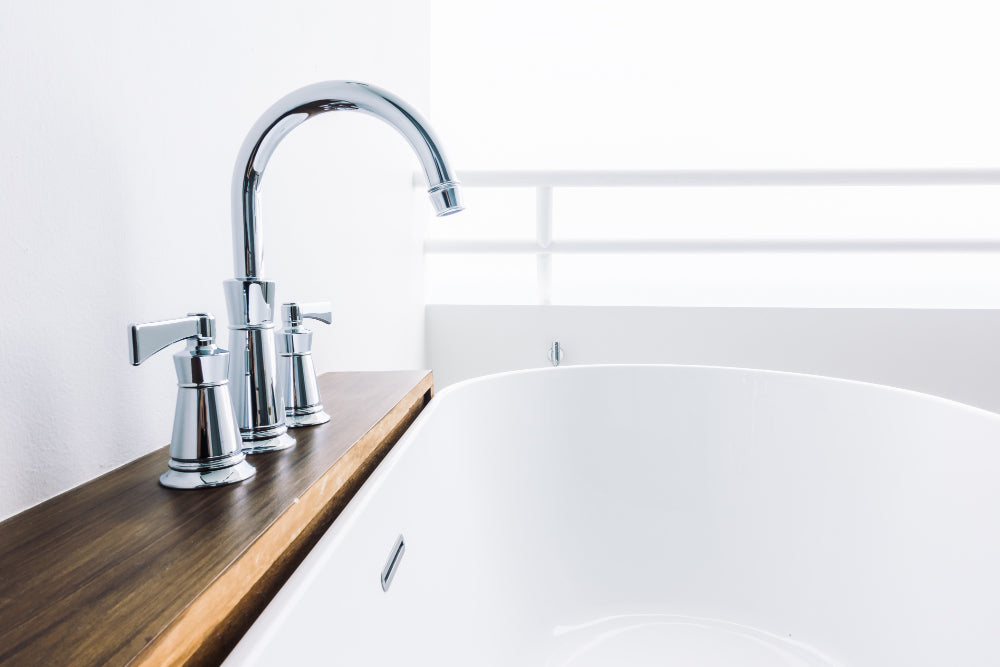 "Close-up of high-quality bathroom taps and sink accessories made from brass and stainless steel, emphasizing durability and premium craftsmanship."