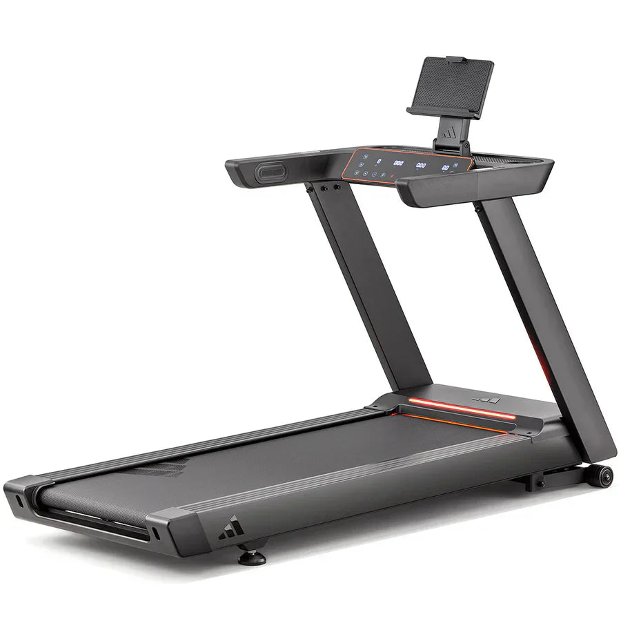 "Person adjusting treadmill settings on a digital display panel to calibrate distance tracking accurately."