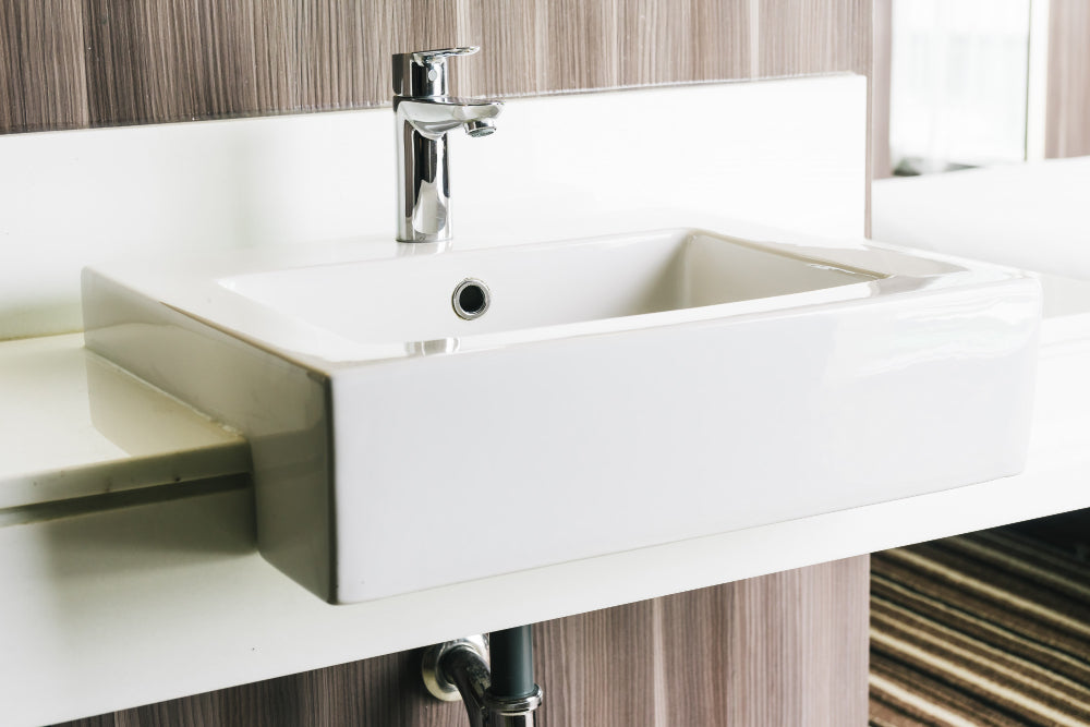 "Side-by-side comparison of an undermount sink and a vessel sink, highlighting differences in design and installation."