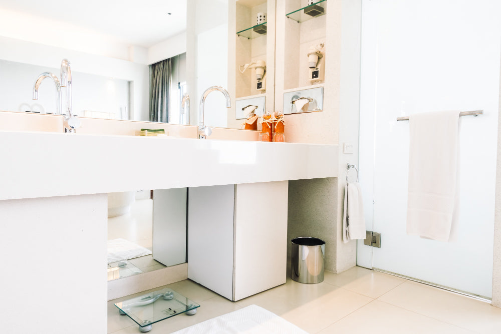 "Side-by-side bathroom setup featuring a wall-hung vanity and a floor-standing vanity, highlighting differences in style, space usage, and installation type."