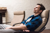  "Modern zero-gravity recliner in a living room setting, featuring built-in heat and massage functions for enhanced comfort and relaxation."
