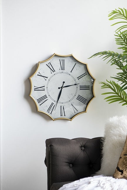 Scalloped Wall Clock, Featuring a crisp white clock face with bold Roman numerals, this design is framed by a stunning gold scalloped edge for a touch