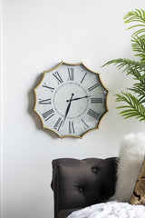 Scalloped Wall Clock, Featuring a crisp white clock face with bold Roman numerals, this design is framed by a stunning gold scalloped edge for a touch