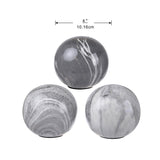 Set of 3 Grey Marbleized Balls. Decorative topper to a stack of magazines - Front View