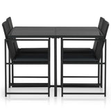 5 Piece Outdoor Dining Set with Cushions Poly Rattan Black - Front View