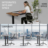 FORTIA Sit To Stand Up Standing Desk, 120x60cm, 72-118cm Electric Height Adjustable, 70kg Rated, Walnut Style/Black Frame - Low Angle