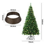Tinseltown LED Christmas Tree 2.4M 8FT with Rattan Tree Skirt Warm Light Green - Top-Down View