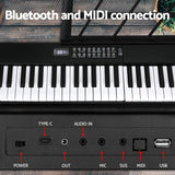 Portable 61-Key Digital Piano Keyboard with Bluetooth and Accessories - Top-Down View