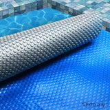 Aqua Buddy Pool Cover 500 Micron 7x4m Swimming Pool Solar Blanket Blue Silver - Close-Up Angle