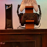 black 3-in-1 PS5 and Xbox Controller Stand – Compatible with PlayStation 5/Xbox Consoles. A gaming desktop organizer with a headphone hanger, non-charging base that holds 2 controllers and headphones. Space-saving white/black console accessory. - Extra Image