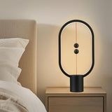 Black Magnetic Balance LED Table Lamp: USB-Powered, Dimmable Eye-Care Light with Award-Winning Design for Australian Homes & Offices - Close-Up Angle