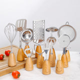 Kitchen Utensil Set - 12 Piece - Includes a peeler, egg separator, spoon, fork, pizza cutter, bottle opener, spatula, slotted spoon, grater, soup ladle, whisk and toothpick holder - The perfect gift for a housewife. - Side View