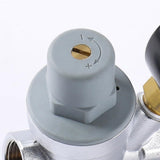 Adjustable pressure reducing valve with integrated pressure gauge for hot and cold water, brass pipe valve for home, commercial and industrial use (DN15) - Side View