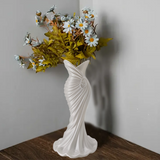 This elegant dress vase combines high-fashion elegance with minimalist home décor. Whether you insert real flowers into the glass tube or display artificial flowers without the tube, it is exceptionally beautiful. - Side View