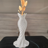 This elegant dress vase combines high-fashion elegance with minimalist home décor. Whether you insert real flowers into the glass tube or display artificial flowers without the tube, it is exceptionally beautiful. - Top-Down View