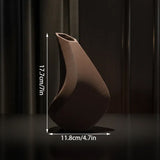 3D-printed sculpture of a contemplative vase,black - Top-Down View