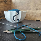 A 3D-printed yarn bowl to accompany your knitting and crochet time. White. - Front View