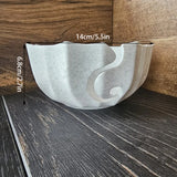 A 3D-printed yarn bowl to accompany your knitting and crochet time. White. - Top-Down View