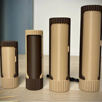 3D-printed compact rotating organizer capsule, 1.3 inches long x 3.4 inches high.