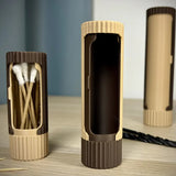 3D-printed compact rotating organizer capsule, 1.5 inches long x 4.9 inches high. - Top-Down View