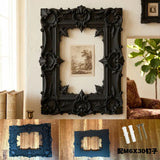 A gorgeous 3D-printed wall-mounted picture frame, perfect for displaying antique prints. Black.