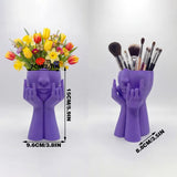 3D-printed rock face vase or office organizer, black. - Front View