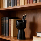 3D-printed rock face vase or office organizer, black. - Side View
