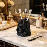 3D-printed hooded skull organizer, perfect for storing toothbrushes and toothpaste in your bathroom. Black. - Front View