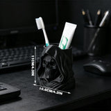 3D-printed hooded skull organizer, perfect for storing toothbrushes and toothpaste in your bathroom. Black. - Side View