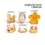 Modern Multi-Piece Floral Ring Collection, Luxe Pearl & Crystal Inlaid Stackable Finger Jewellery, Light Gold, 7 Pack