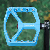pair of wide pedals with non-slip surface and repair function, blue - Front View