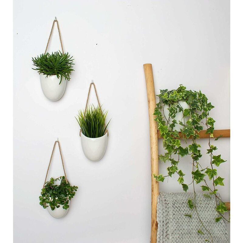 Set of 3 white ceramic hanging wall pots with rope hangers, pots with succulents on a wall