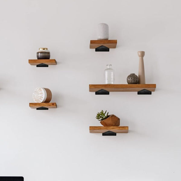 Floating shelf brackets, invisible triangular edges.