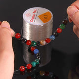 100m Transparent Elastic Jewelry Thread, 1mm Large Roll - Top-Down View