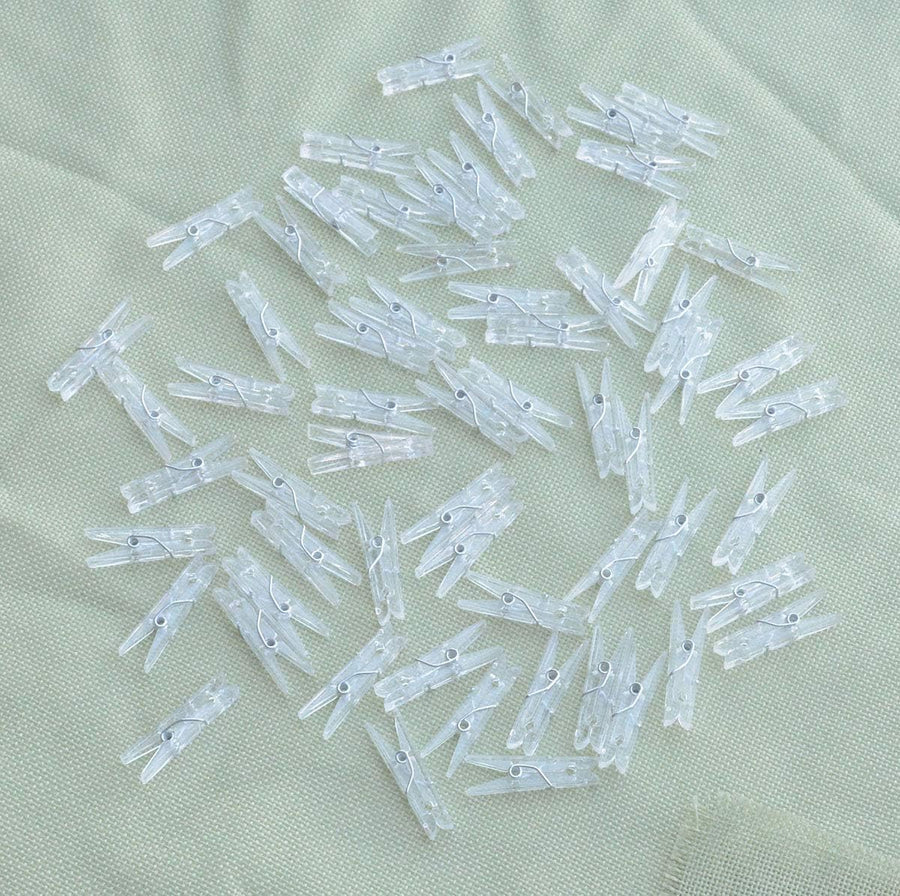 Yansanido 100pcs Mini Clear Plastic Utility Paper Clip, Clothespins Clips, Clothes Line String Clips, mini Clothes Pins for Photo for String Fairy Lights Color Clear(100pcs Clear Plastic Clips)