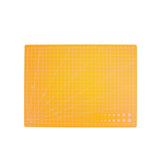 A4 PVC Grid Lines Cutting Board Professional Self Healing Cutting Mat Multipurpose for Quilting Sewing Scrapbooking DIY Craft Orange - Low Angle