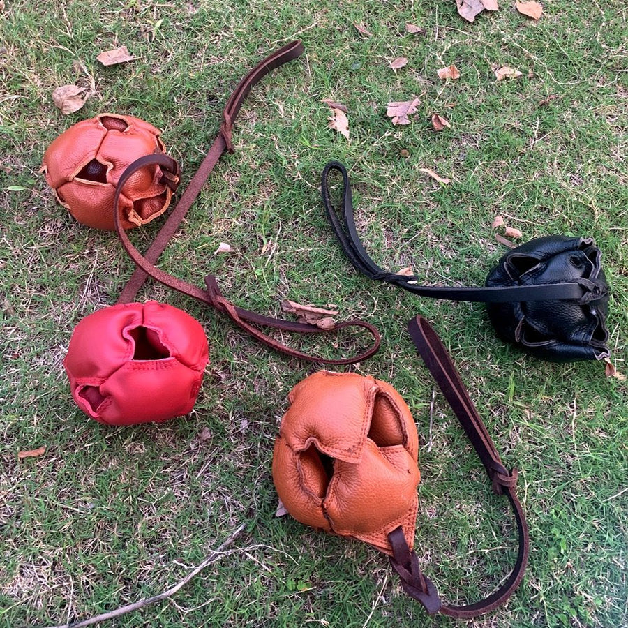 Interactive Leather Chew Ball for Dogs with Durable Rope Handle – Ideal for Puppy Training, Dental Chewing, Outdoor Fetch, and Bonding Play for Small to Medium Breeds (Red)