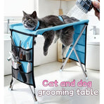 Foldable Pet Grooming Table for Cats and Small Dogs, Multi-functional Care Station with Mesh Bed, Storage Pockets, and Adjustable Restraint Straps for Nail Trimming, Hair Brushing, Bathing, and Ear Cleaning (Blue)