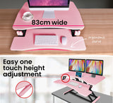 Fortia Desk Riser 77cm Wide Adjustable Sit to Stand for Dual Monitor Keyboard Laptop Pink - Close-Up Angle