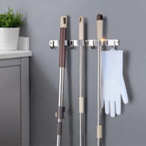 GOMINIMO Stainless Steel Broom Mop Holder Wall Mount with 3 Racks 4 Hooks (Grey) - Close-Up Angle