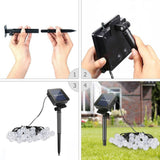NOVEDEN 100-Bulb Warm White Solar String Lights with 8 Lighting Modes - Close-Up Angle