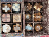 12 Puzzle Brain teaser interlocking wooden Puzzle set in a Deluxe Gift Box -for kids or adults - Front View