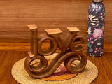 Wooden carved LOVE words decoration 27 cm long - Top-Down View