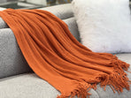 Levi orange throw rug blanket, soft fabric, 130cm x 170cm, soft cosy fabric texture