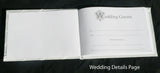 White Wedding Guest Book Register with Silver Pen Matching Stand Set 36 Lined Pages - White Ribbon and Diamante Bow Cover - Top-Down View