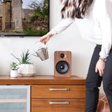 Kanto YU6 200W Powered Bookshelf Speakers with Bluetooth and Phono Preamp - Pair, Walnut with SX26 Black Stand Bundle - Close-Up Angle
